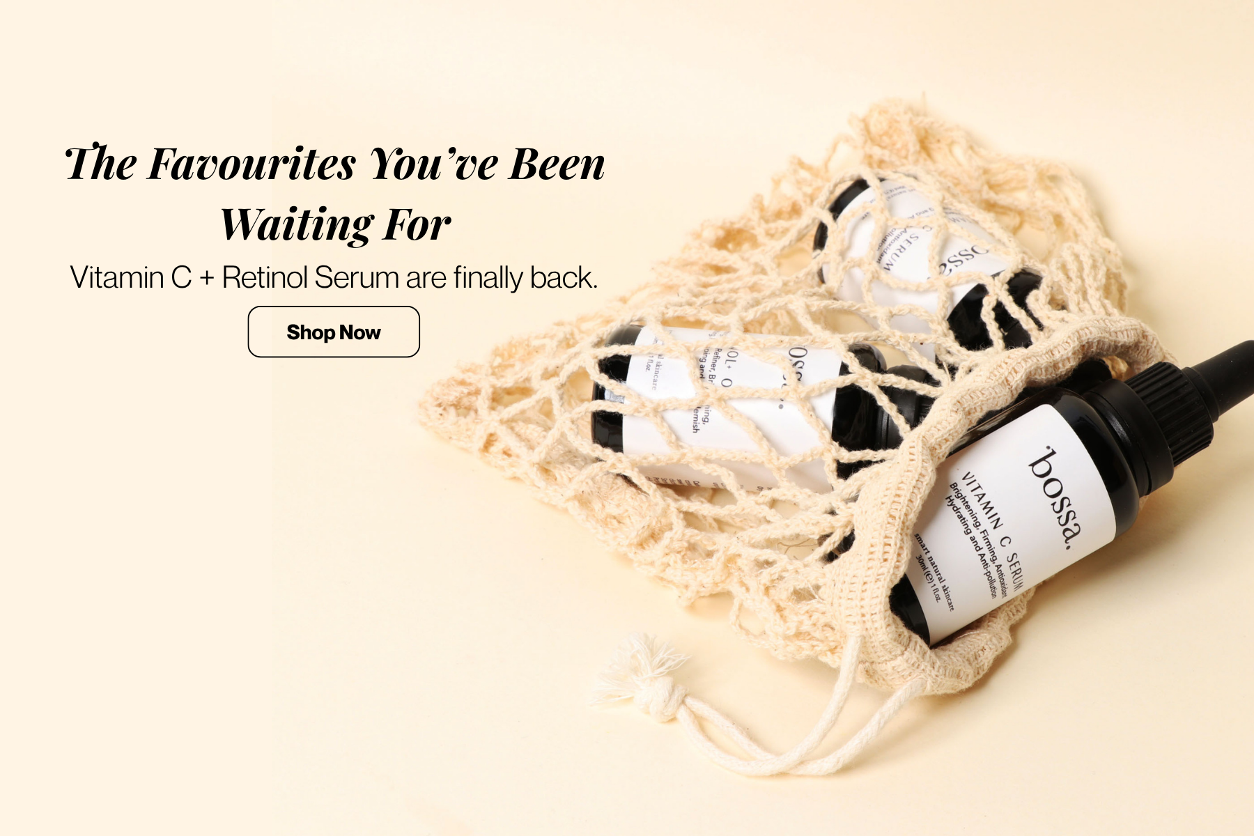 Two cosmetic serum bottles with black caps and white labels are nestled in a beige crochet mesh bag on a warm cream background. Text on the left reads 'The Favourites You've Been Waiting For' and 'Vitamin C + Retinol+ Serum are finally back.